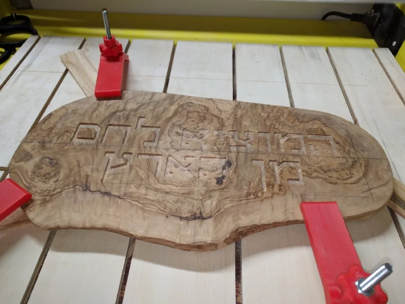 The finished inscription is a little inconsistent in depth due to the wood not being perfectly flat. A planer would have come in handy.