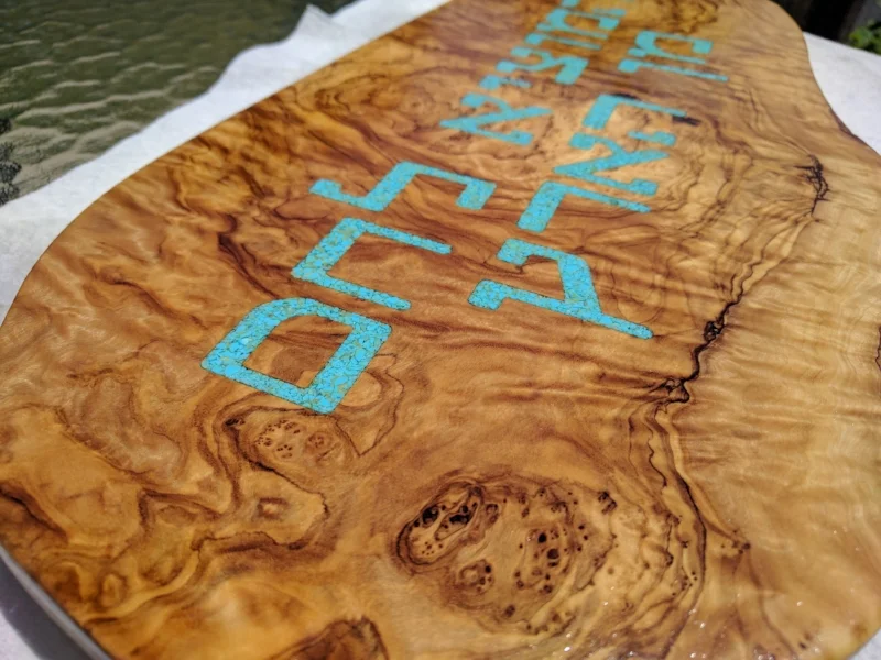 Closeup detail of the wood and turqoise.