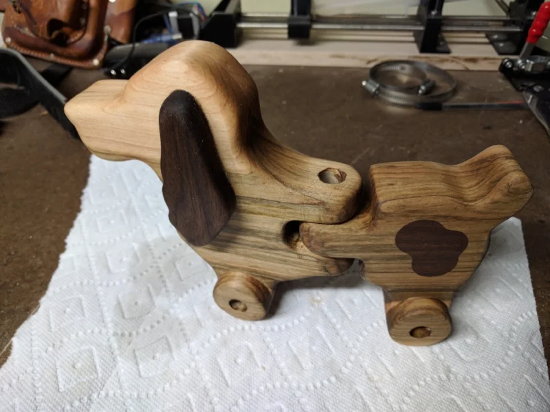 I drilled a hole for the center hinge and pull string. If I was to do this again I would drill the hole from the bottom and stop short of breaking through the top. The wood was finished with a couple coats of Danish oil to bring out the natural grain of the maple.