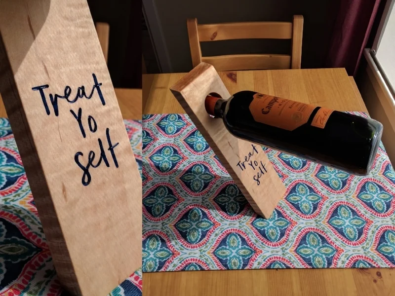  Balancing wine bottle holder.&nbsp; Curly maple engraved on the CNC.&nbsp; Getting the right cut angle was a little bit of trial and error. 