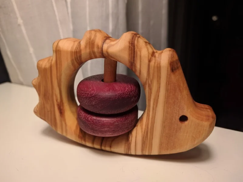  Hedgehog teether/rattle inspired by similar ones available online.. A present for my new niece, made from olive wood and purple heart for the beads. 