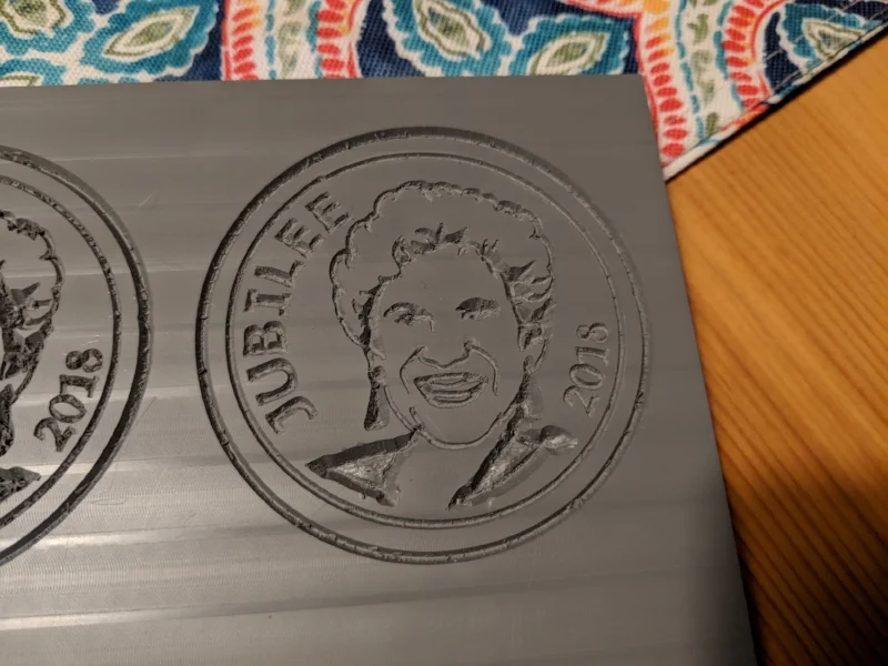 It took two attempts to get a good engraving, the extruded plexi I was using is not the ideal material but it was what I had on hand. The engraving was a little fuzzy and required quite a bit of manual clean up.