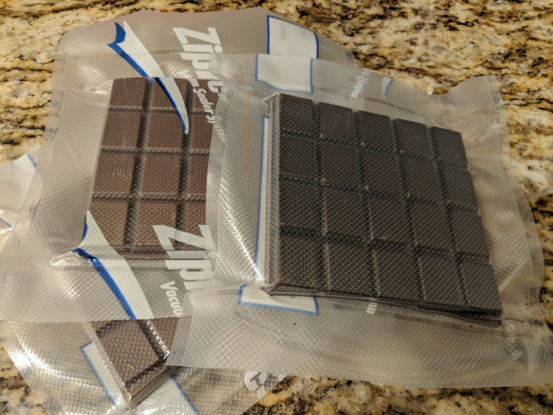 After trying traditional methods of chocolate tempering, and failing repeatedly I turned to science and technology.   Serious Eats  has a chocolate tempering method using a sous vide circulator.  Step one is vacuum sealing the chocolate. 