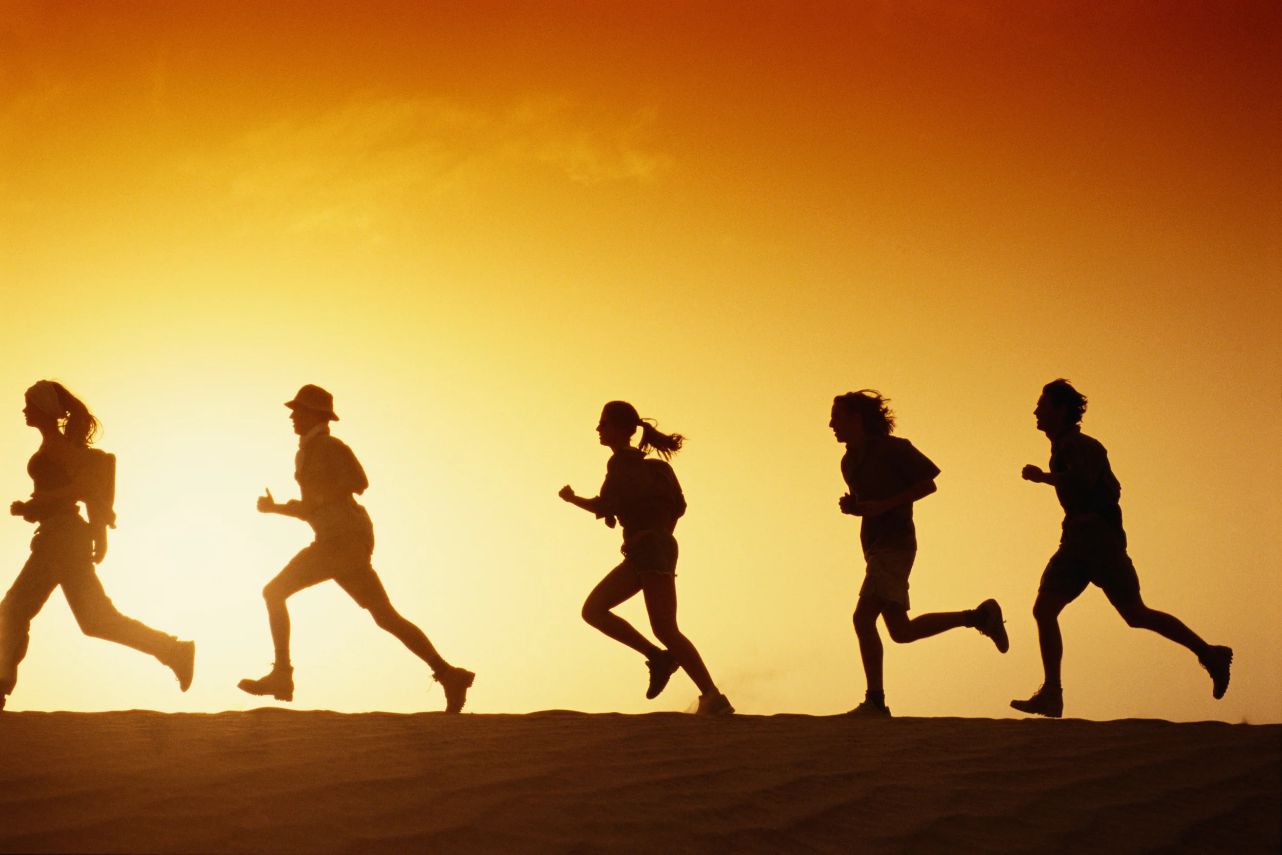 People running in desert at dusk - 200259790-001.jpg