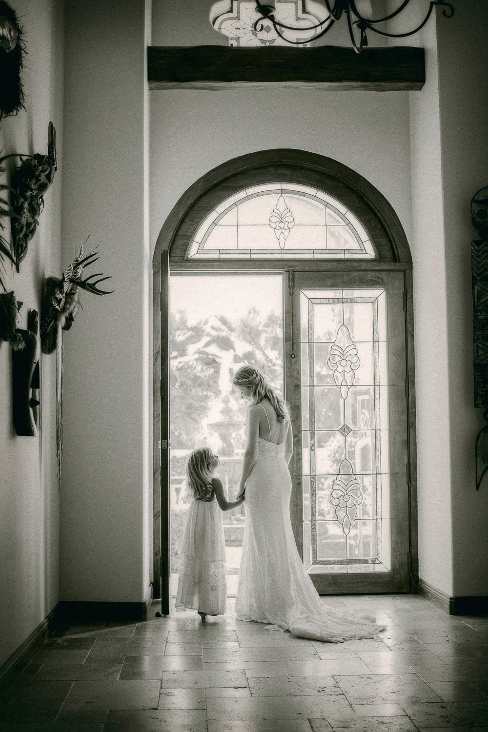 bride-with-flowergirl-doorway.jpg