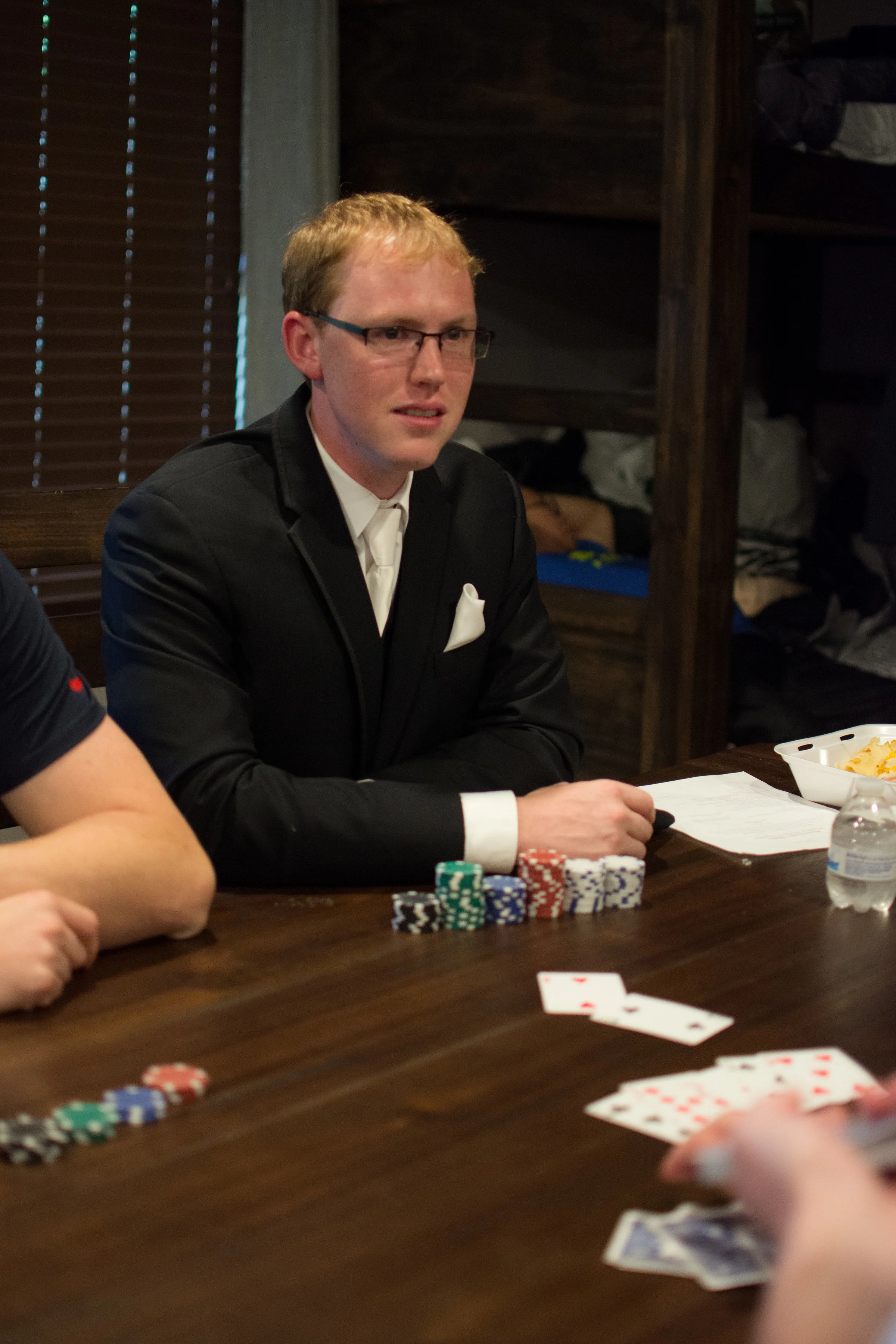 The boys play poker to ease some nerves. 
