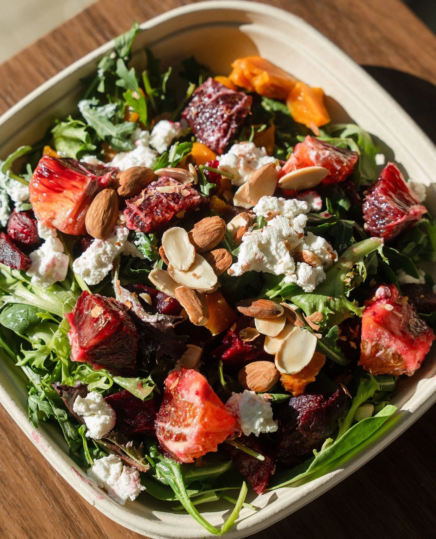 A beautiful lunch worth sitting down for. Take your time and dig into our Beet Salad. local. beets &middot; mixed greens &middot; seasonal citrus &middot; goat cheese &middot; sprouted almonds &middot; seed oil-free house balsamic vinaigrette.