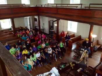 Local students gather at Mt. Zion Church for one of the many Mosby Heritage Area Association programs held throughout the region each year. Top: Willowcroft Winery, one of Loudoun County's first vineyards.