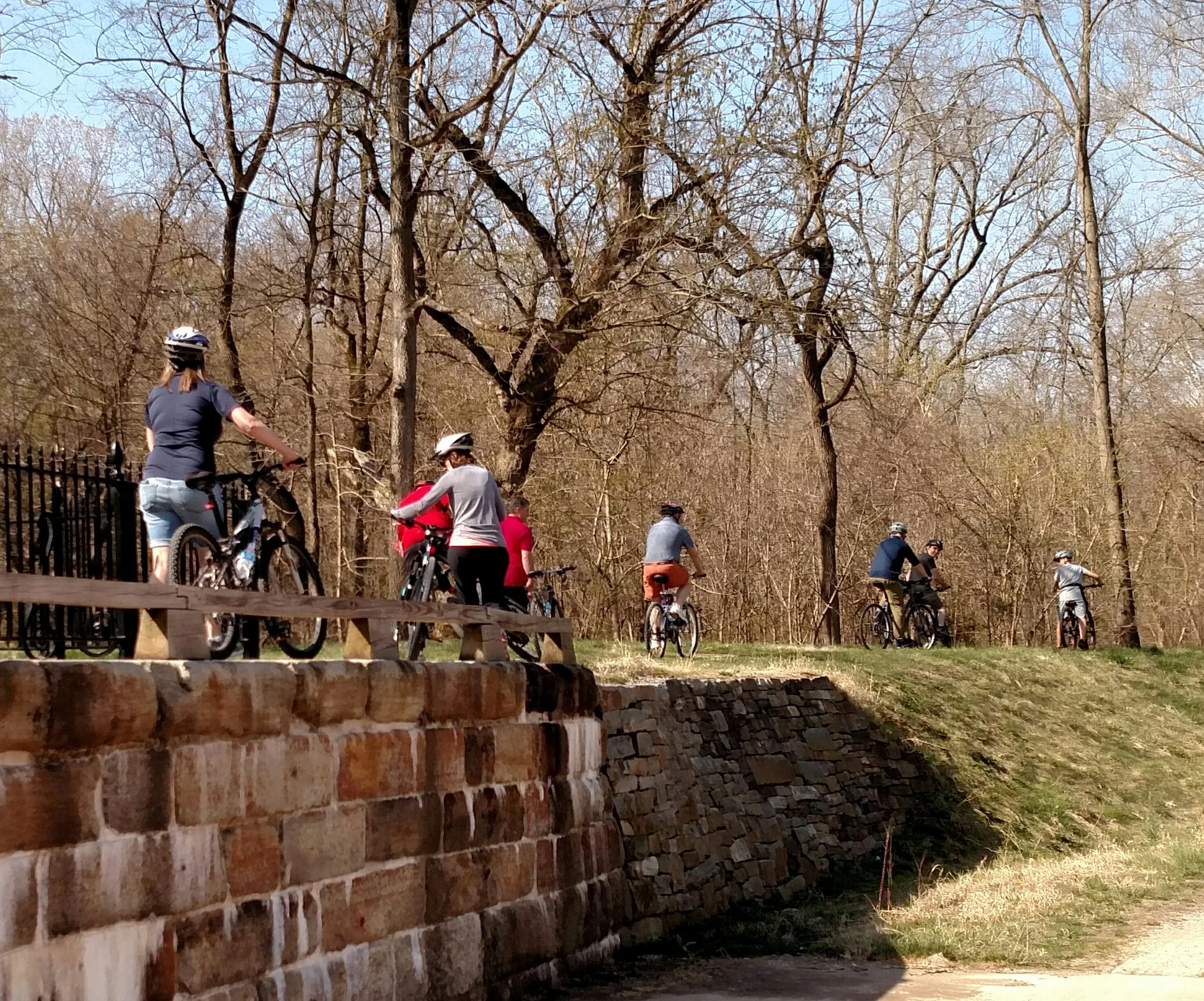 Riders cross the Catoctin Aqueduct on our C&O Canal in the Civil War bike tour.
