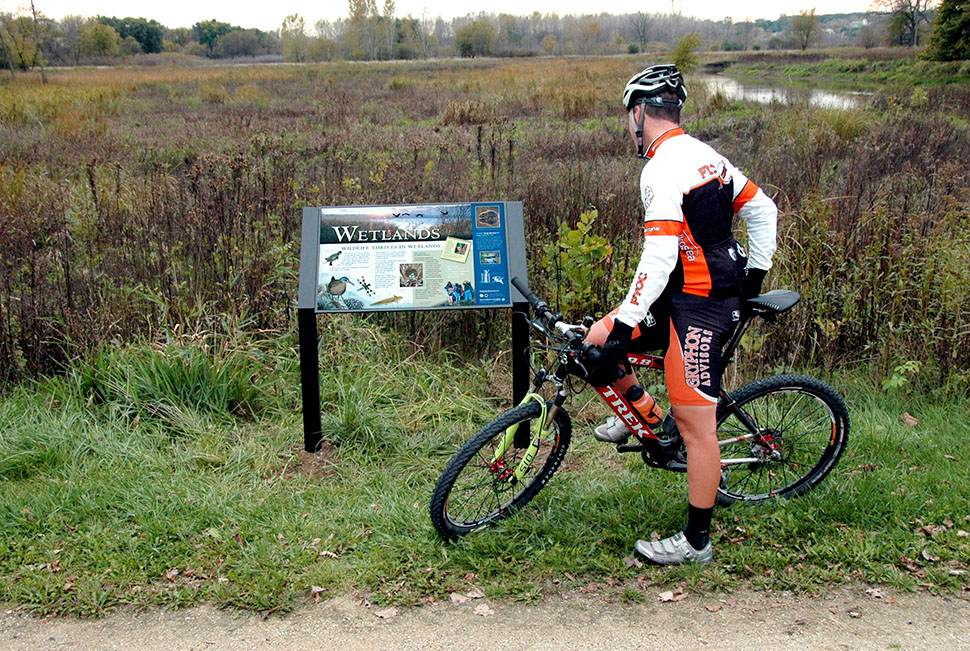     WE DESIGN INTERPRETIVE  TRAIL SIGNS     