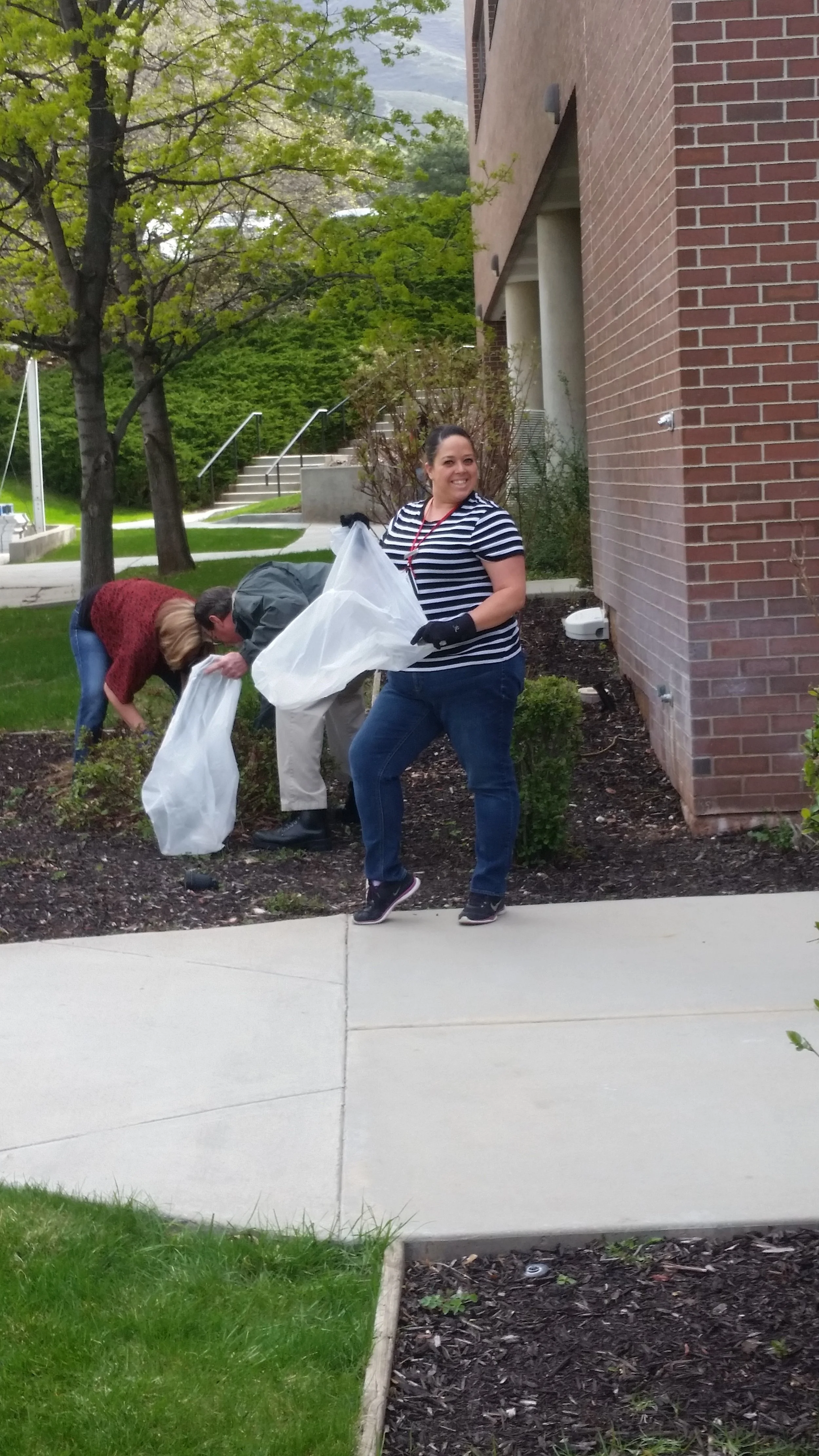 Housekeeping manager Jessica helping clean up trash on earth day.