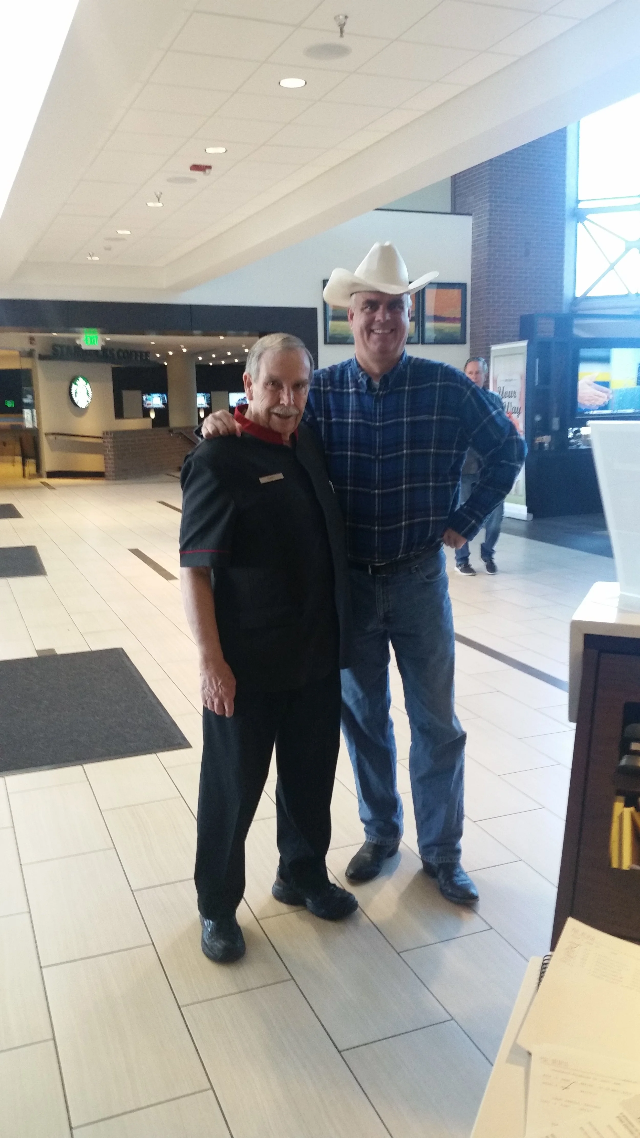 GM Steve Dennis and shuttle driver Gary posing for a picture during the down syndrome easter egg hunt.