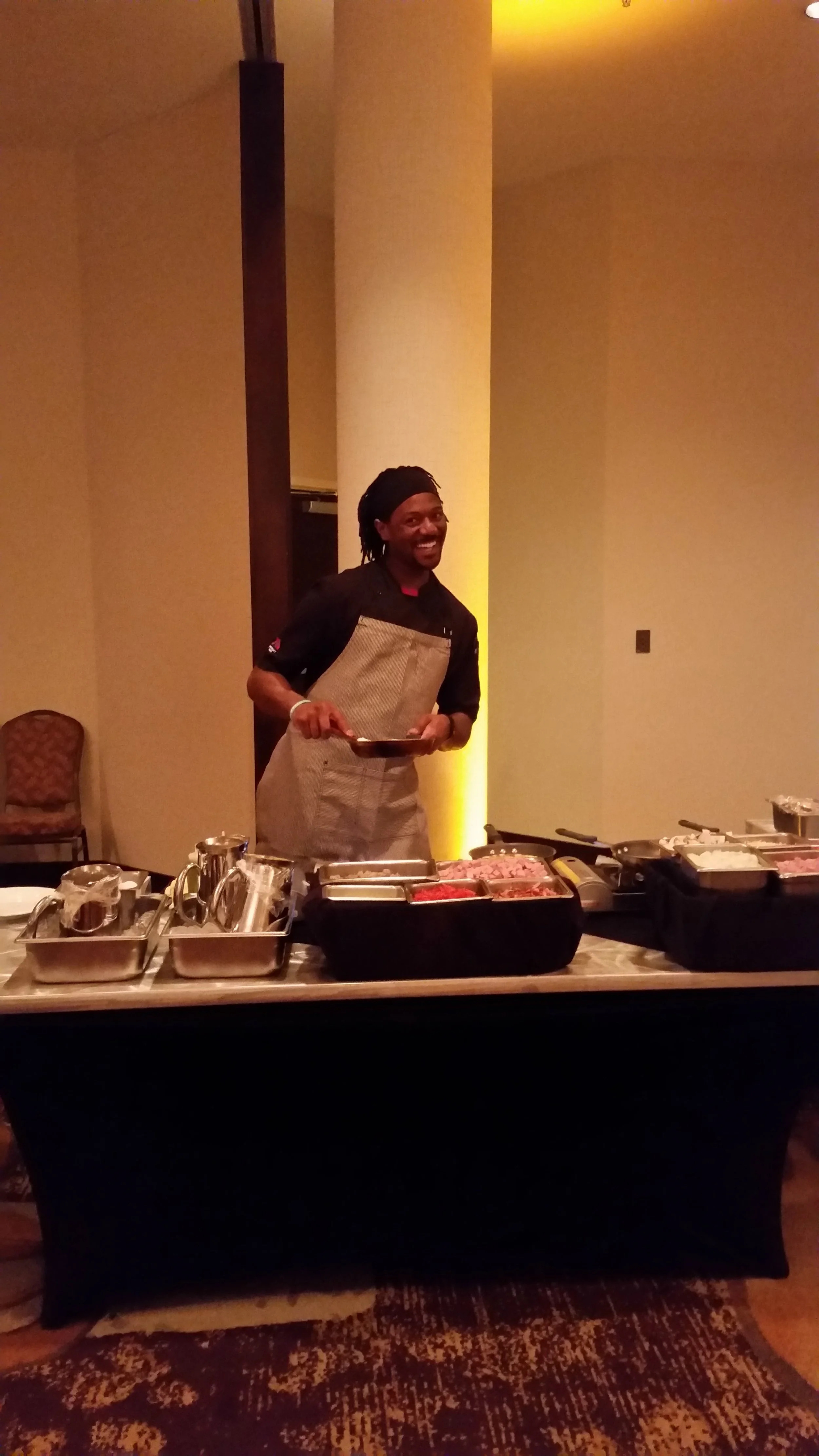 TJ having fun working the omlet station.