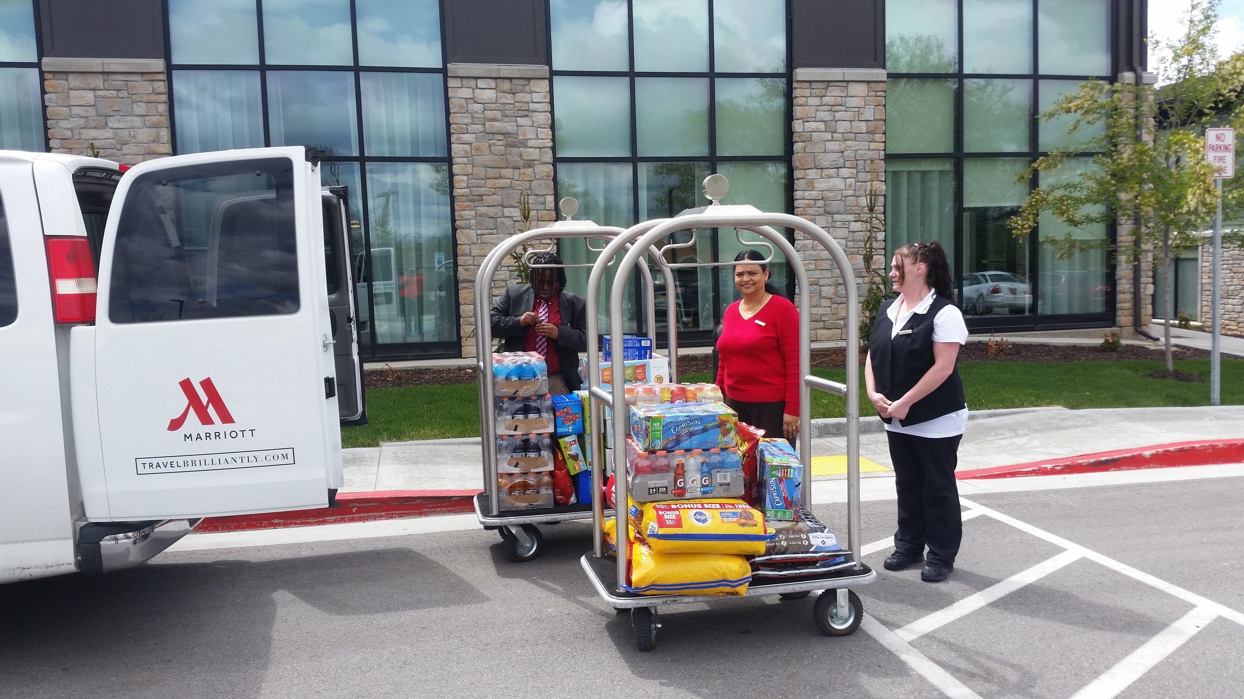 Front office manager Jericka, HR coordinator Beulah and Housekeeping supervisor Echo getting all the food loaded up to take to the wounded warrior retreat in Park City , utah.