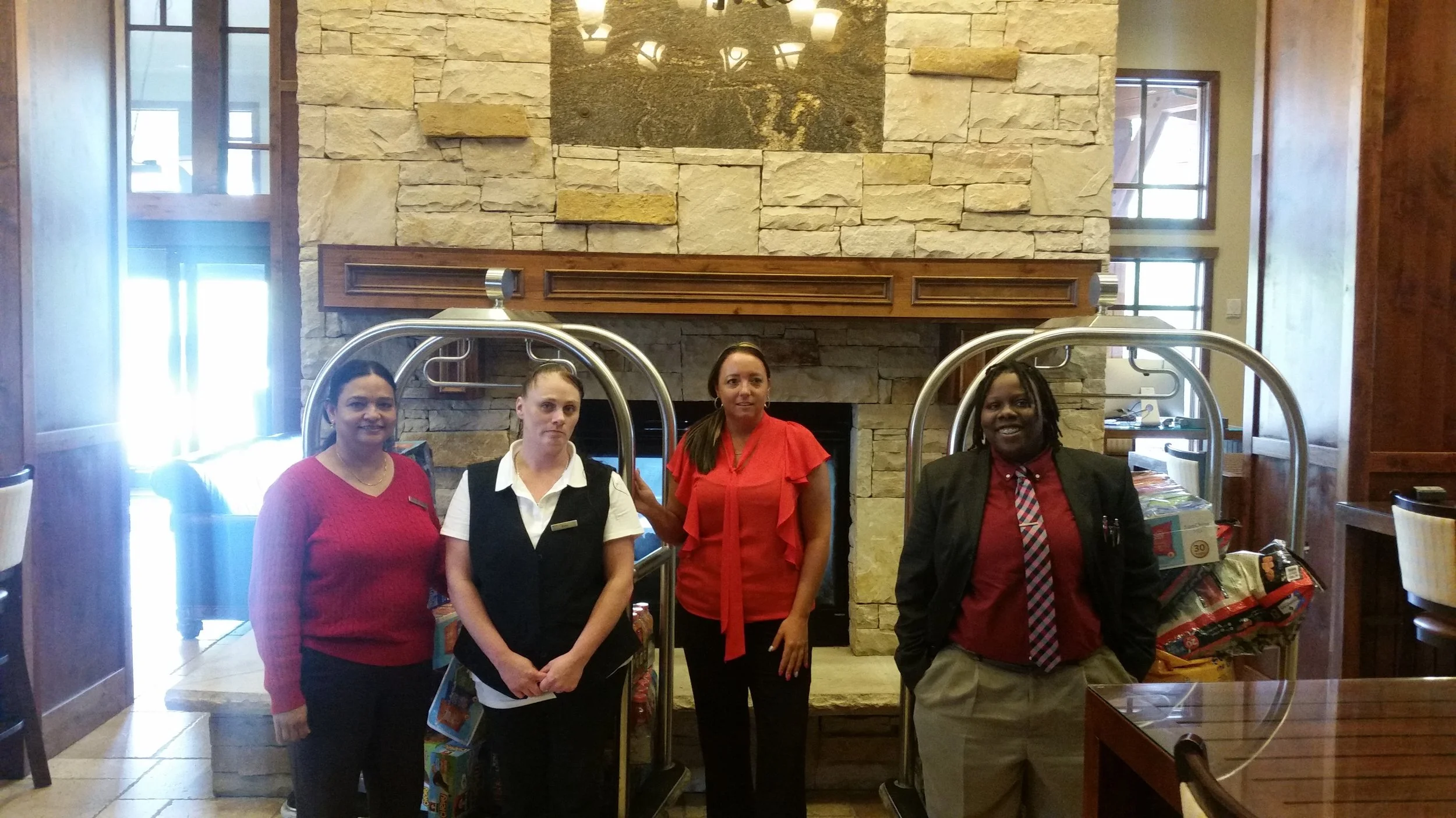 Hr coordinator Beulah, Housekeeping supervisor Echo, Night manager Jennifer and Front Office manager Jericka posing for a photo after delivering all the food and dog food for the Wounded Warrior Retreat in Park City Utah. 