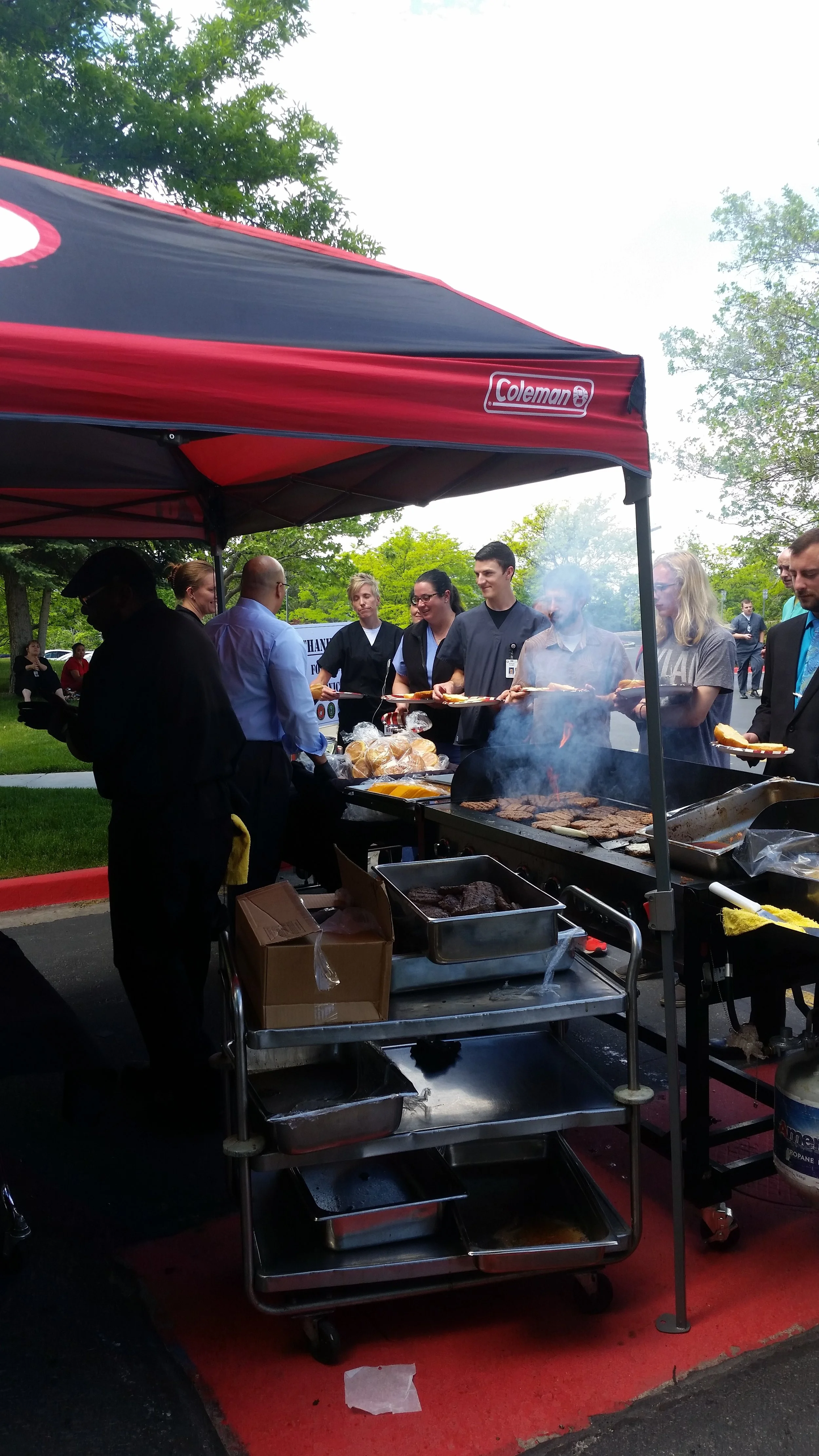 Sous chef Chris, F&B outlet manager Brian serving burgers and pulled pork sandwiches to our guest. 