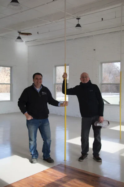 Norad Mill owner David Moresi of Moresi and Associates and Tunnel City Coffee owner Paul Lovegreen in Tunnel City Coffee’s new space at Norad Mill. Photo by Sydney Lester