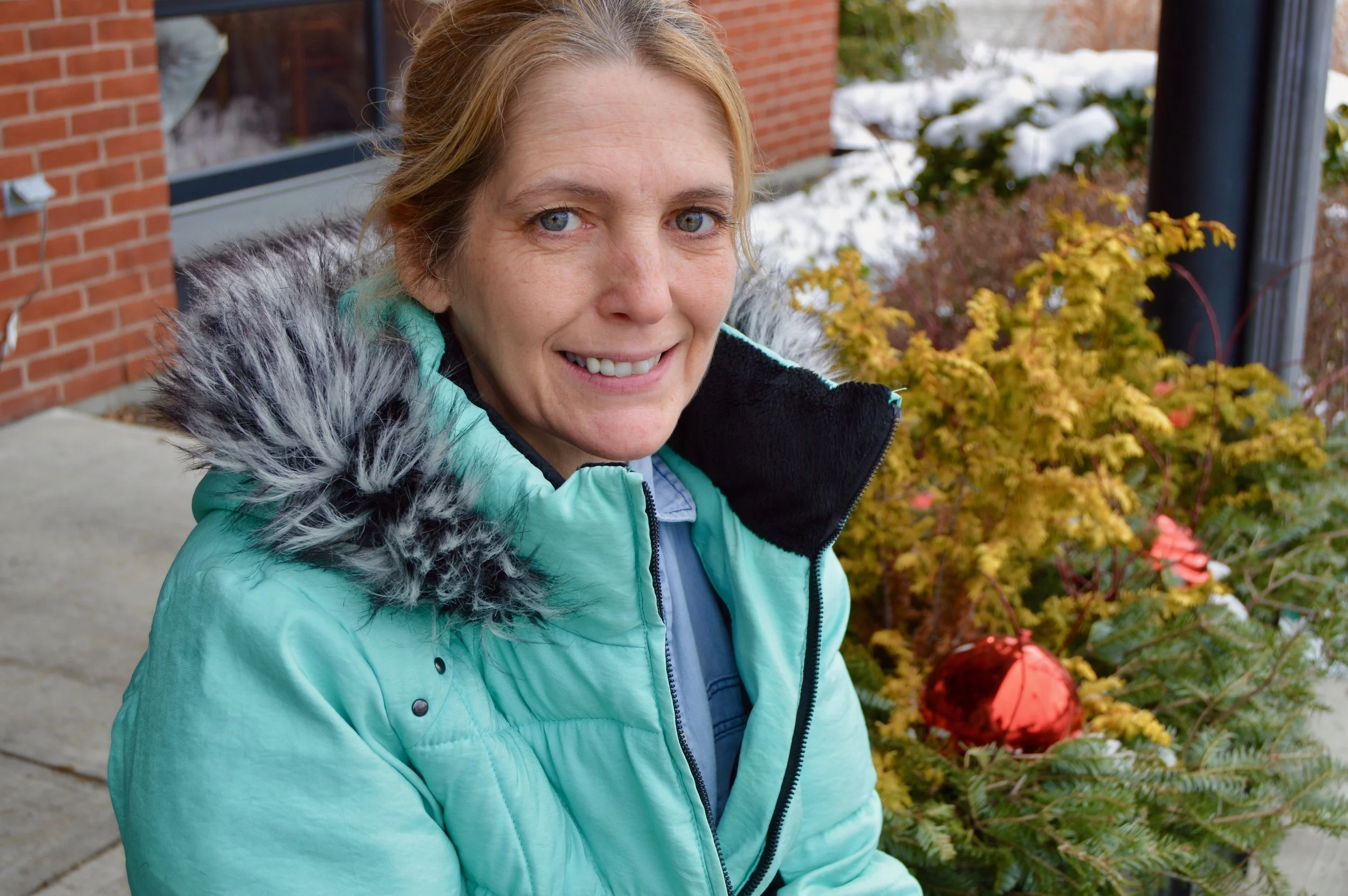 Tunnel City Coffee employee and local painter Jean Bourn will sell work in the winter art exhibit at 100 Spring St. Photo by Makayla McGeeney