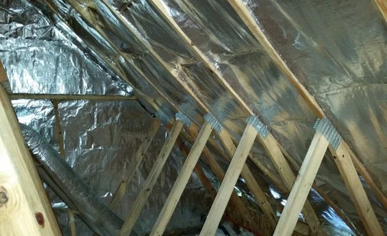 RADIANT HEAT BARRIER INSTALLED IN THE ATTIC