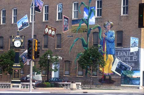 Its Merits Recommend It: the DeKalb Community Mural, 1999, acrylic paint on brick, by Olivia Gude.