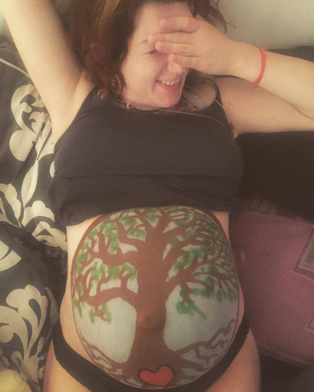 My partner did this for his first baby and it was so much fun - just face paint that washed off but a nice way to celebrate the pregnancy just shy of 39 weeks.