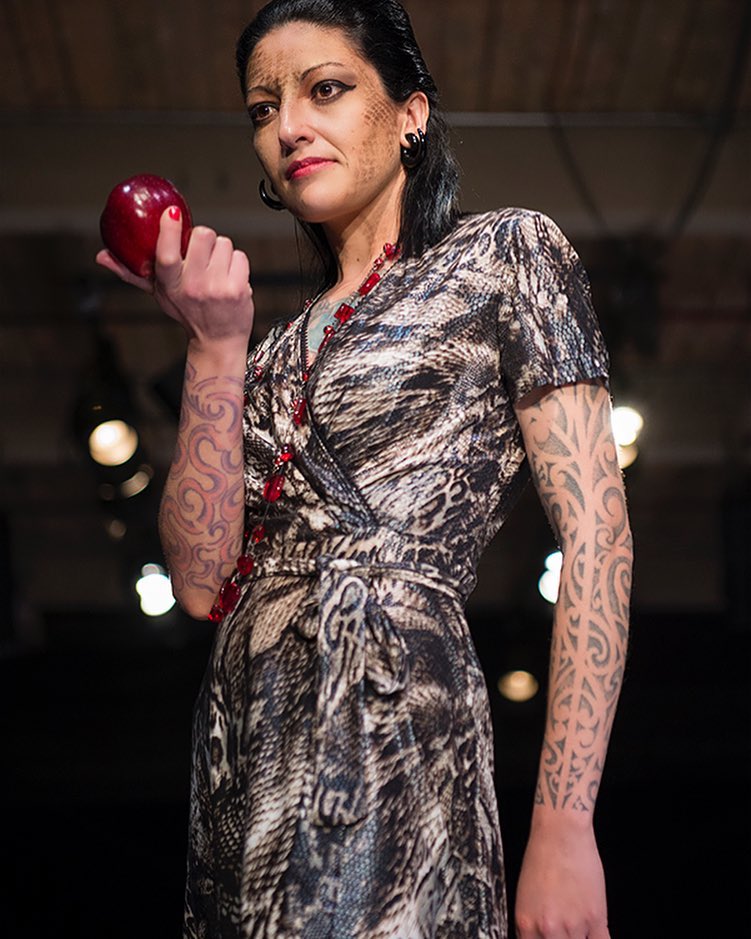 Model Alessandra offers a bite of the forbidden fruit. Featuring tattoos by Os Paredes, make up by Jenna of Glitter and Gore Makeup Artistry and hair by Stina Scott. 