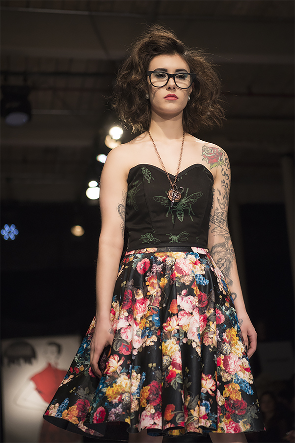 Kaylaa wears freshly picked flowers from a midnight garden and a bustier with original silkscreened art by Bryce Huffman. Photo by Andy Burleigh, glasses courtesy of Advanced Vision.
