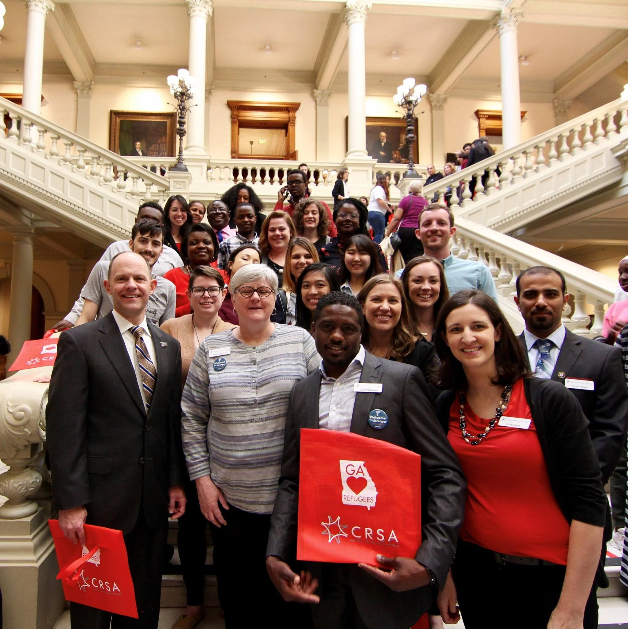 John with our refugee services staff and volunteers at the Capitol