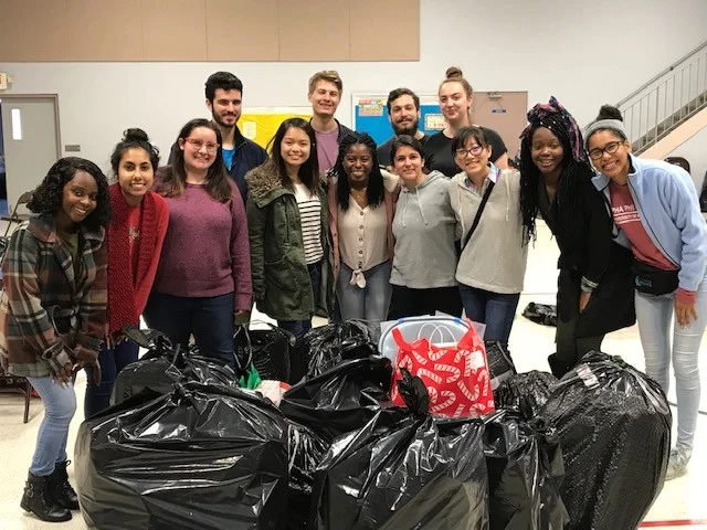 University of Florida students help sort and deliver hundreds of gifts for Inspiritus families