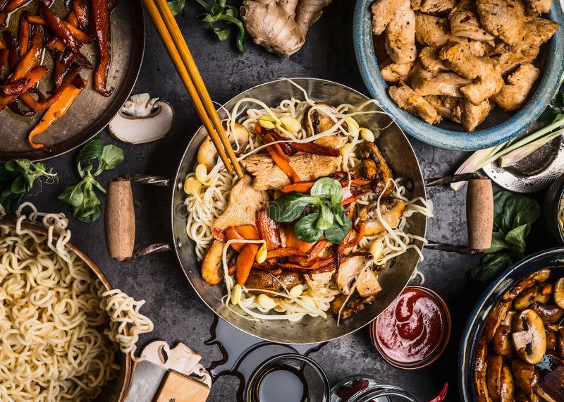 asian-kitchen-table-food-bowls-wok-stir-fry-chopsticks-ingredients-background-top-view-85895742.jpeg