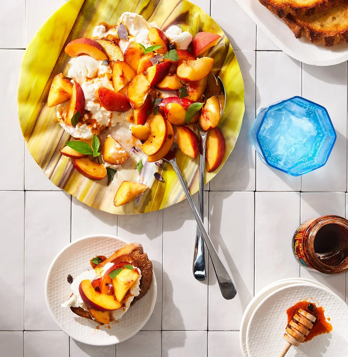 August deliciousness styled for @flavourfull.ca: Peach season is peaking&mdash;and it&rsquo;s completely derailed our content plans. We had other things lined up, but this is all we want to eat: juicy peaches, cool burrata, a honey-chili crisp drizzl
