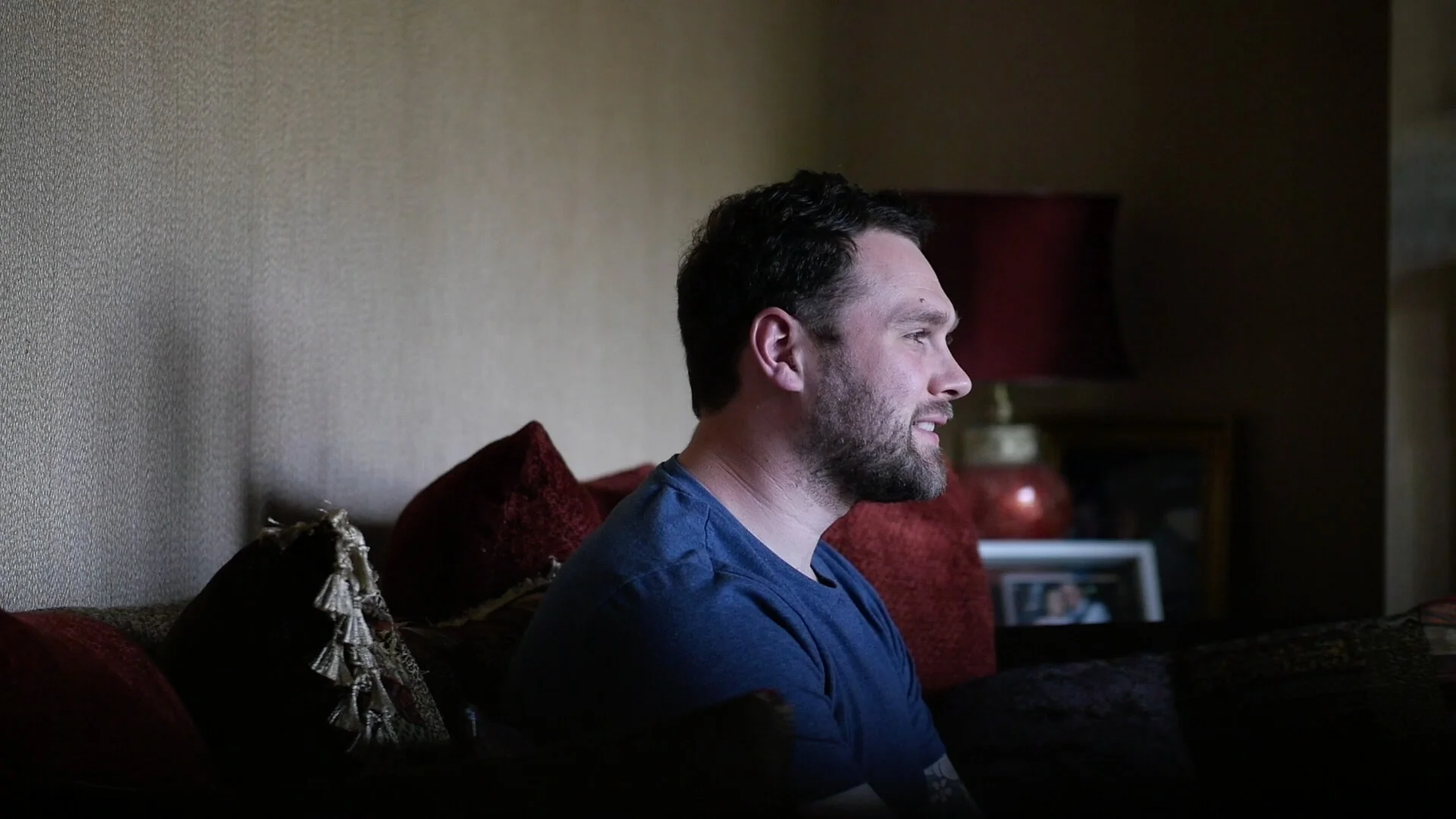 Image showing Luke smiling during his Pre-Wedding Interview, as he reflects upon his proposal to Jennifer.