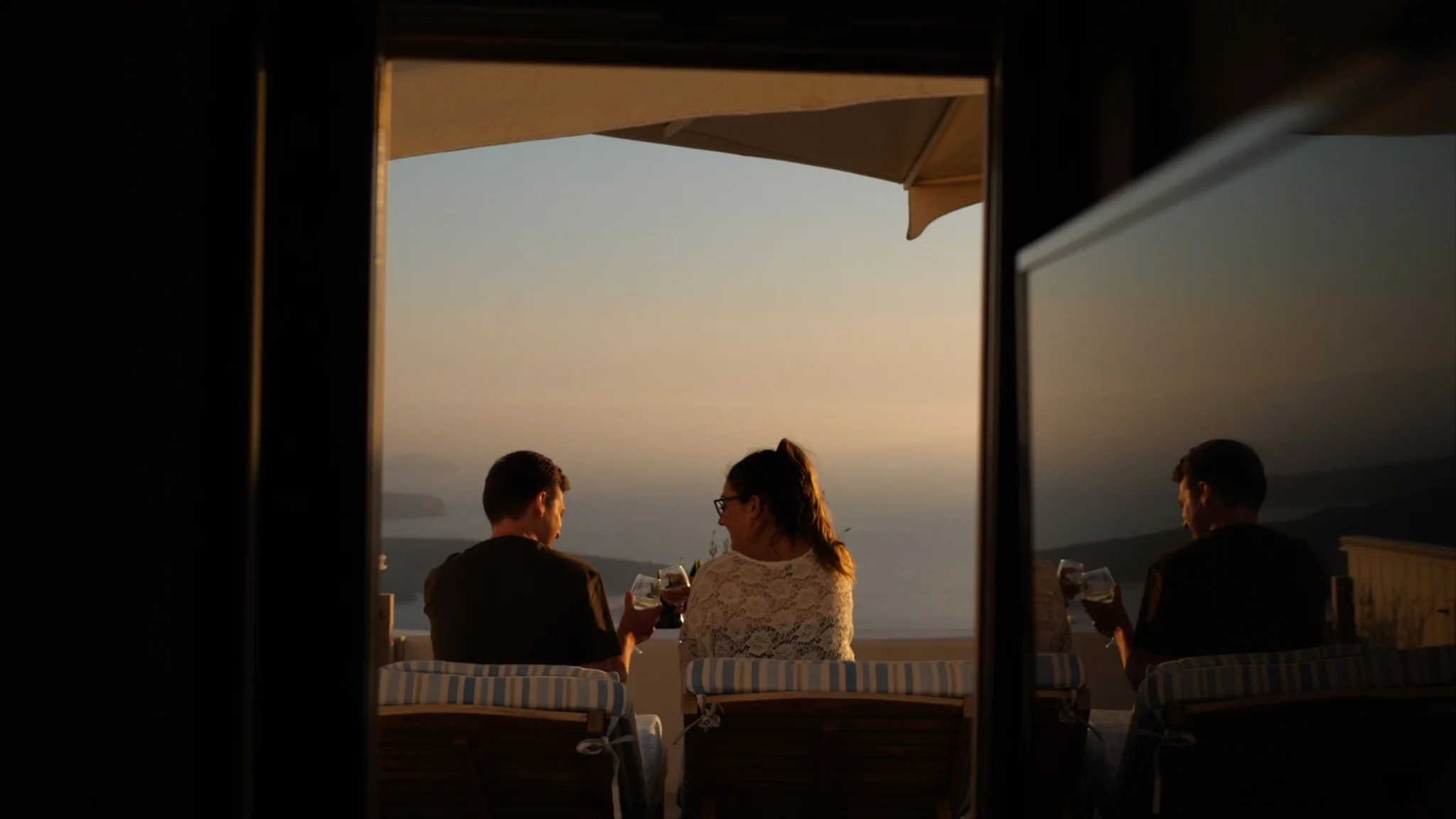 Sara and Gareth share a wine overlooking Santorini's beautiful, blue ocean, whilst looking forward to their wedding day.&nbsp;