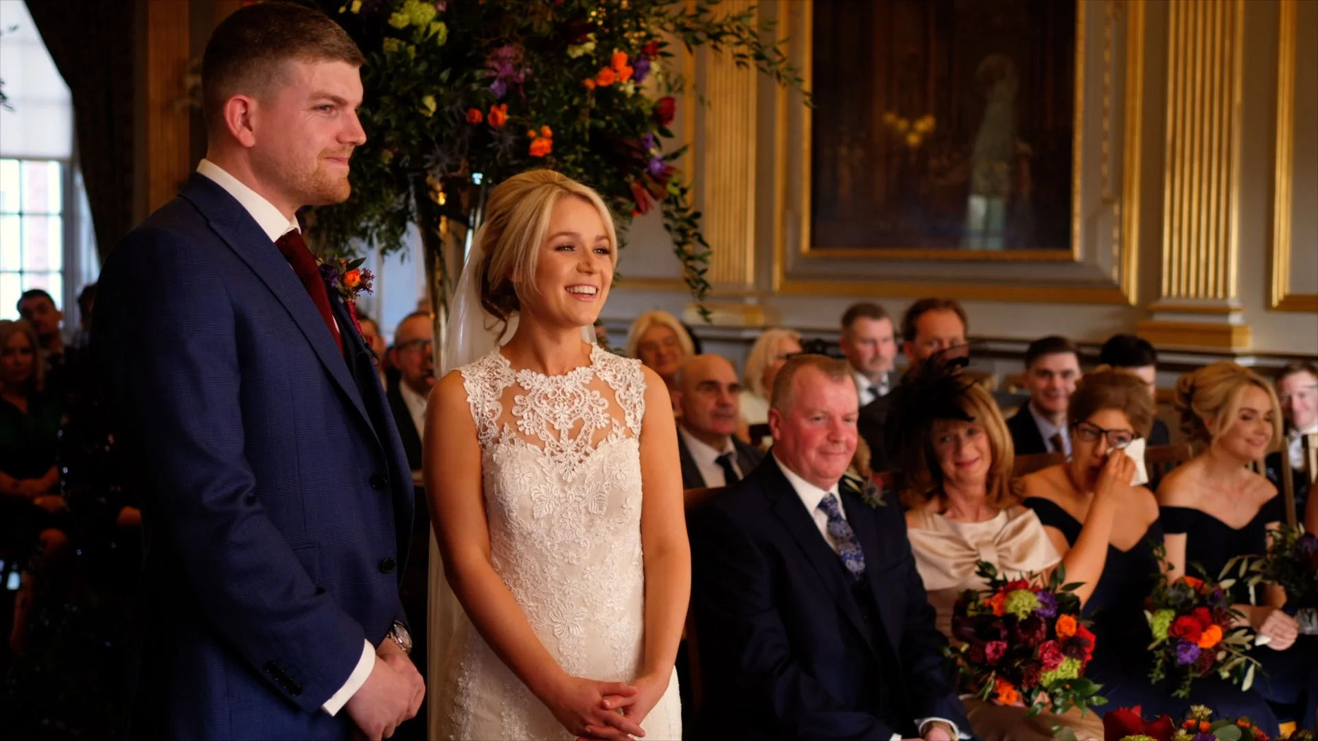 Dan and Jen share a laugh, as one of Jen’s bridesmaids begins to cry during the ceremony at Knowsley Hall.