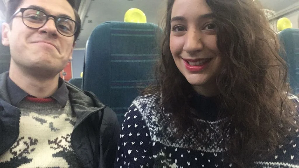 lara and sean christmas sweaters.jpeg