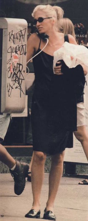 In a black slip dress with Selima Aldo sunglasses