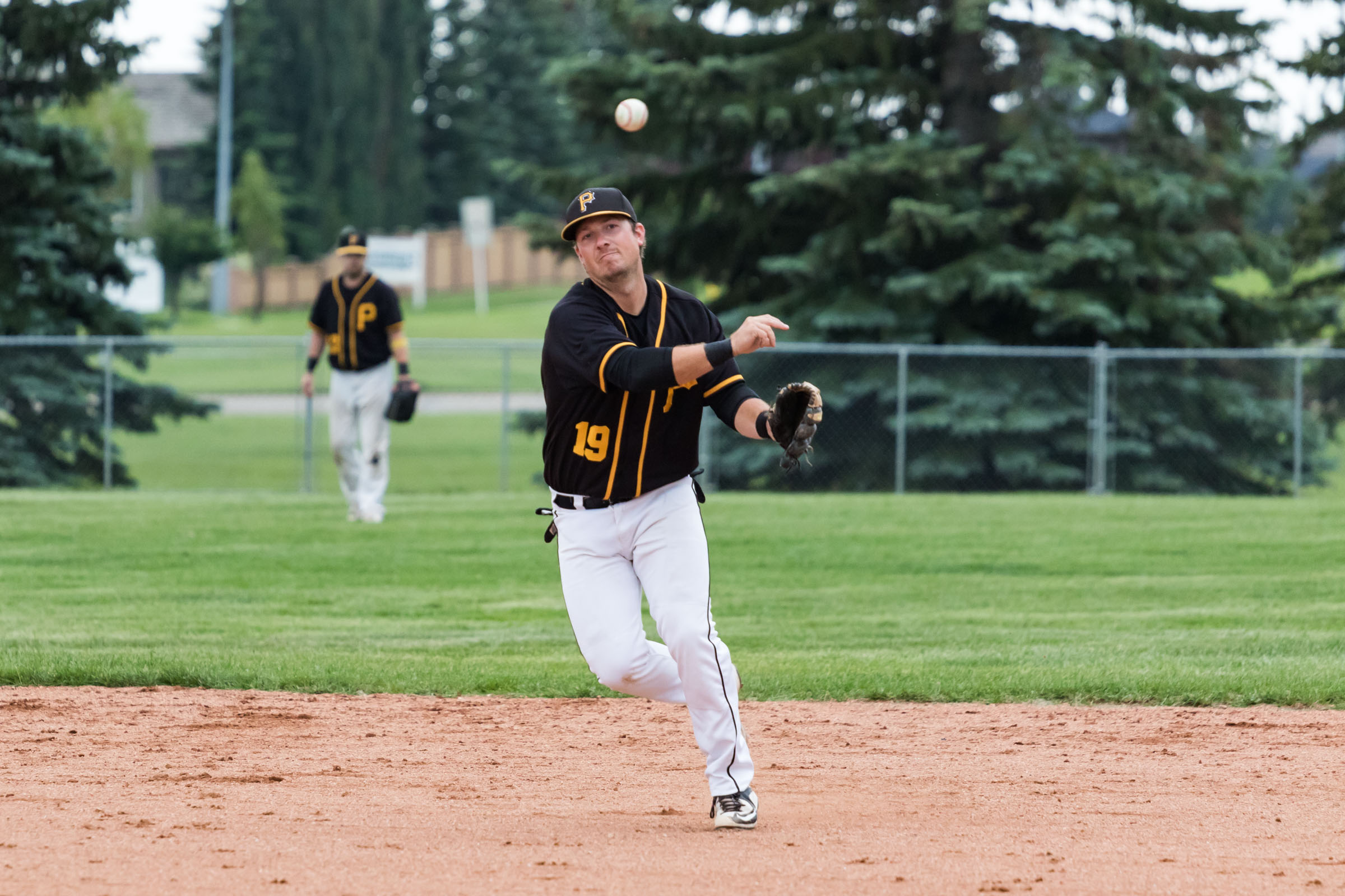 Edmonton Primeaus shortstop Kyle Fagnan throws across the diamond in a game versus the Camrose Axemen in North Central Alberta Baseball League action | July 13 at Harry Andreassen Field, Camrose