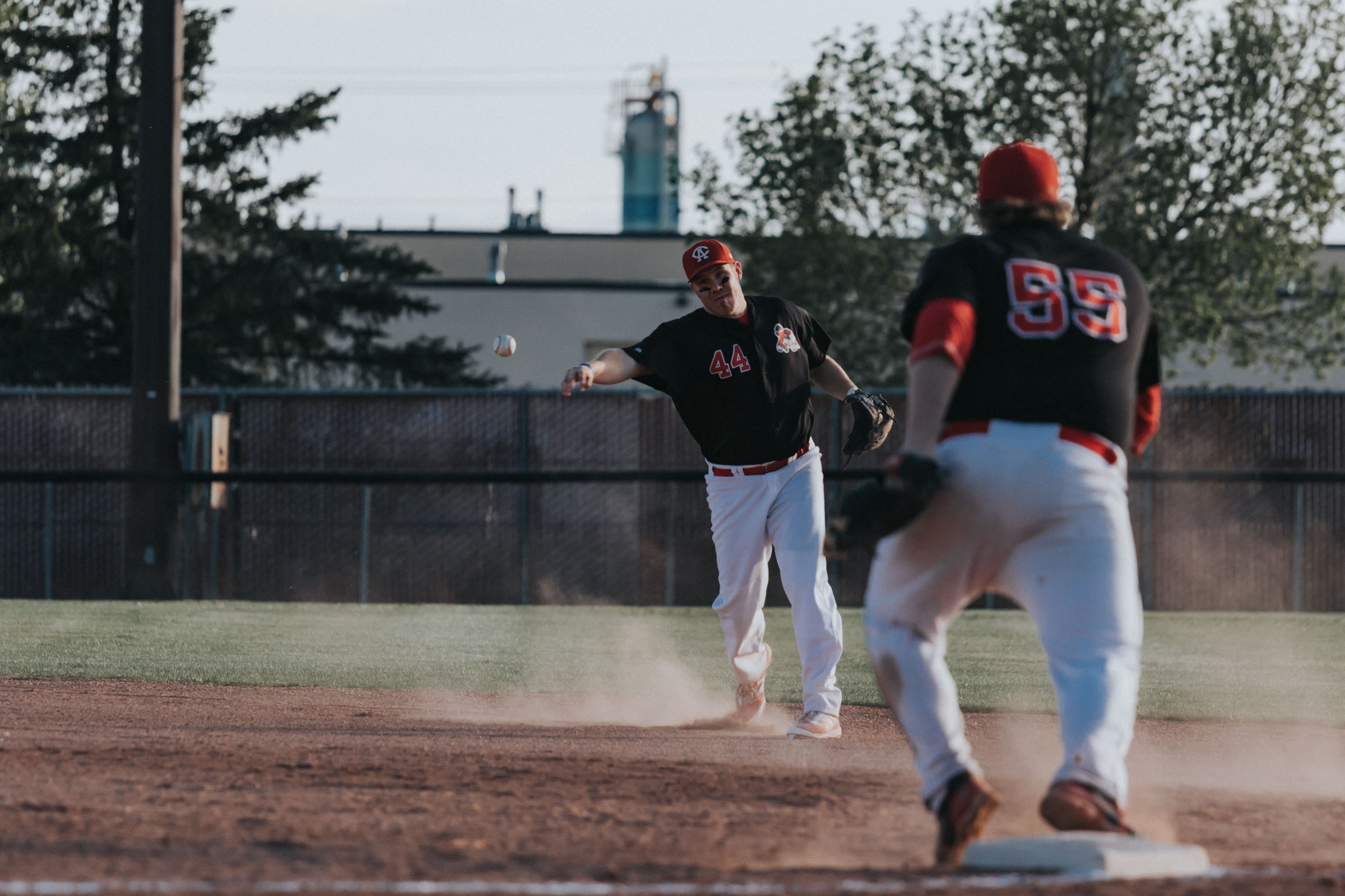 Camrose Axemen second baseman Ryan Petryshyn is in the process of throwing out an Edmonton Primeau hitter while first baseman Joe Pasychnyk sets up at the bag | May 17 at John Frye Park, Edmonton