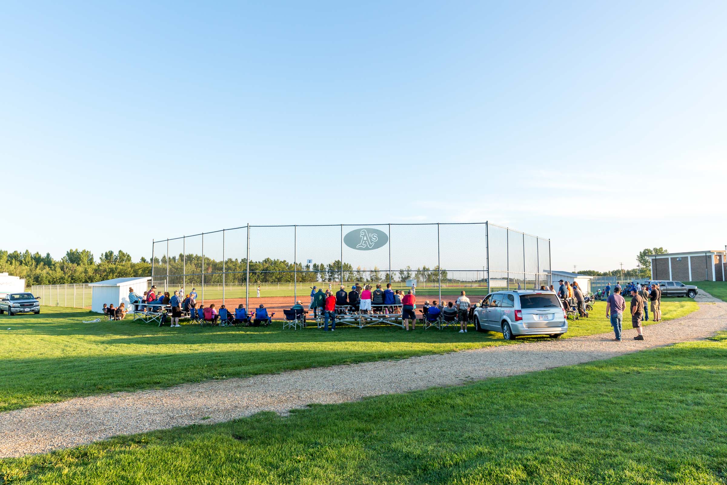 The small village of Rosalind played host to game two of the Powerline Baseball League Championship this season as their Athletics took on the Armena Royals. The small ballpark affectionately known as 'the Homer Dome' due to it's small field dimensions is home to baseball fans in the area | August 4 at Rosalind Ballpark