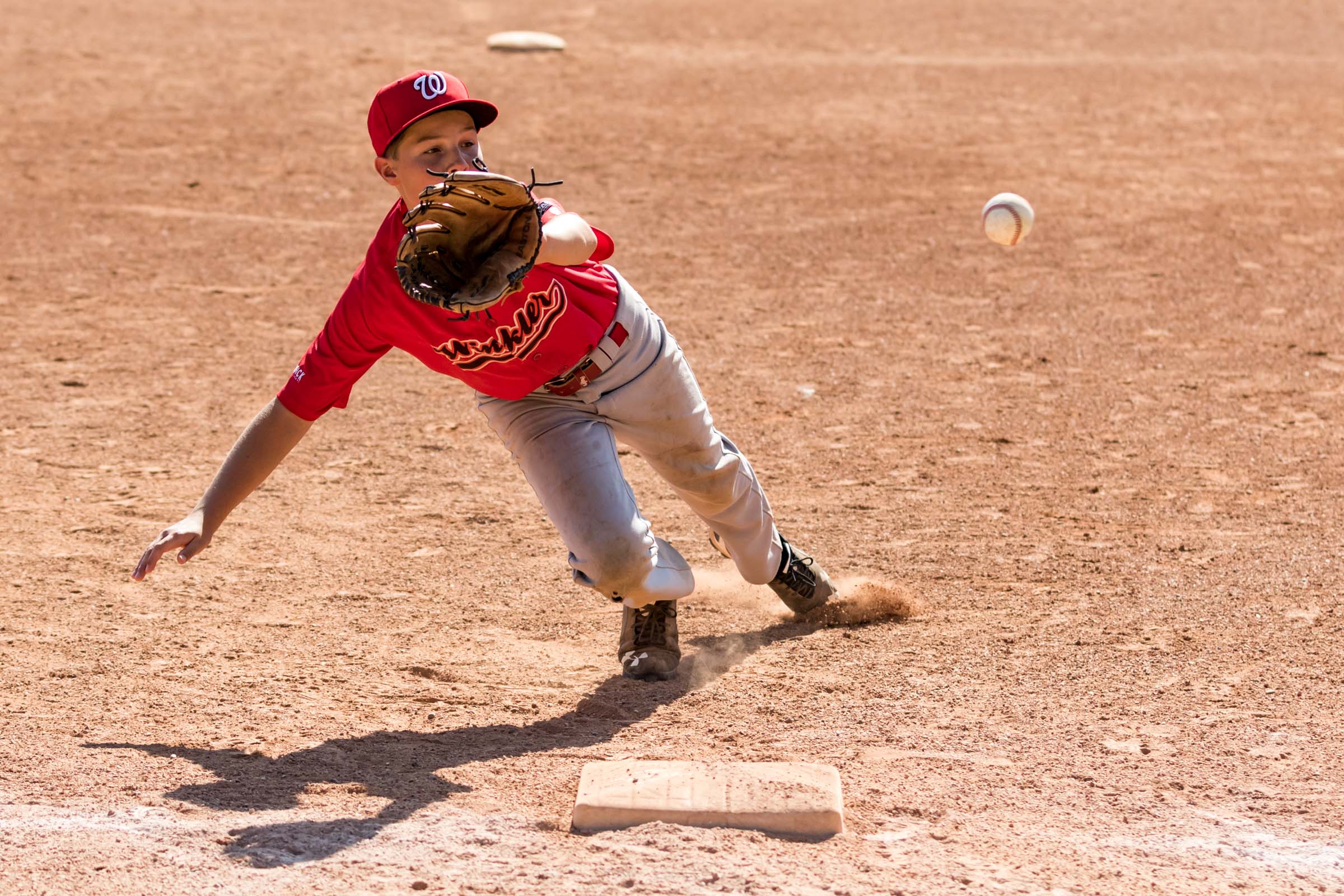 The Winkler (MB) third baseman would be almost completely horizontal when it was all said and done but despite the effort, the ball would evade the youngster at the hot corner | August 14 at Legion Memorial Ballpark, St. Albert