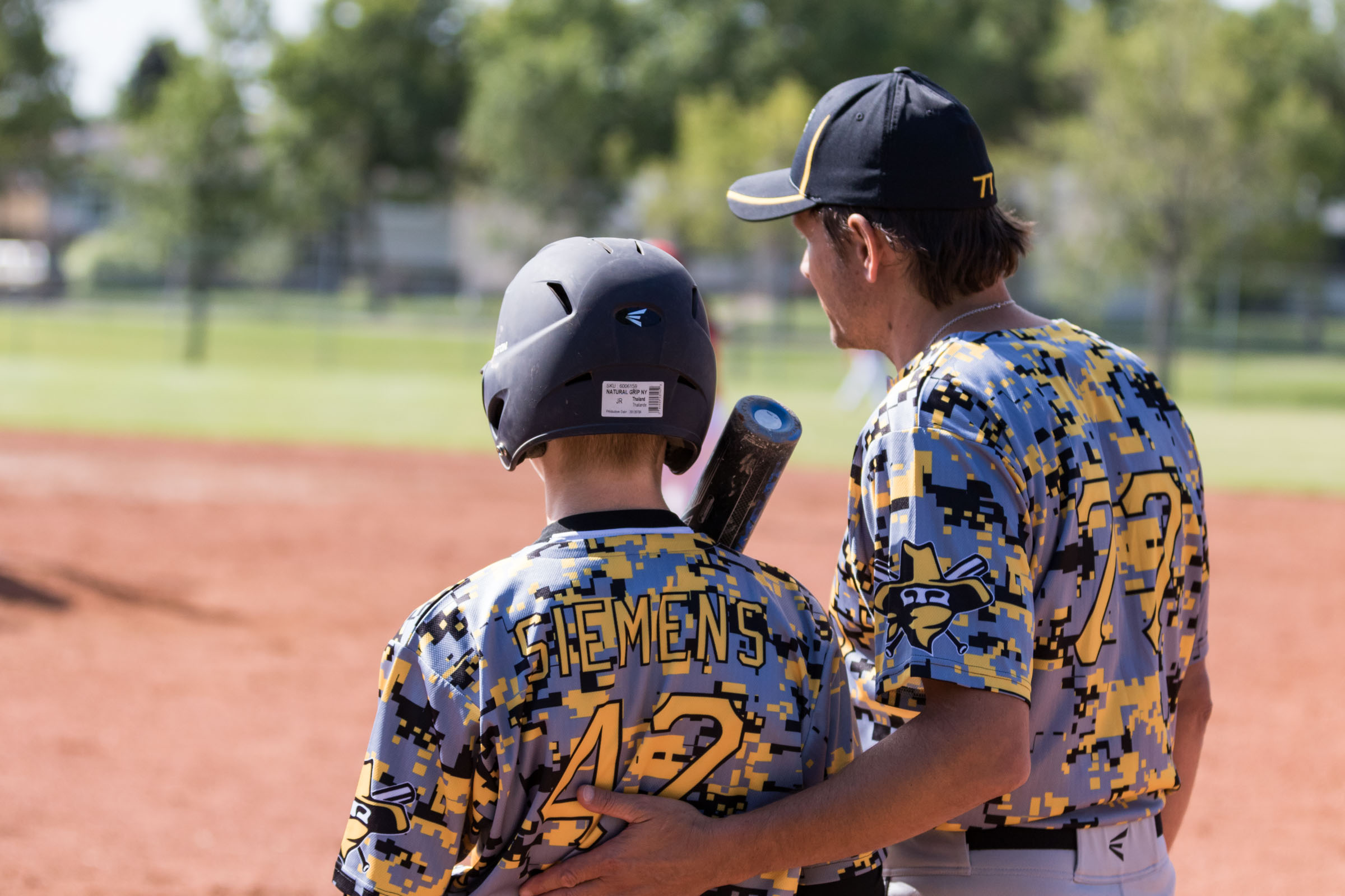 When you are a kid playing baseball, having a good coach who helps you mentally prepare before stepping into the batter's box goes a long way to help a young player enjoy the game and have success. Here a coach from the Calgary Bandits talks to a hitter during a mound visit | August 6 at Rudy Swanson Park, Camrose