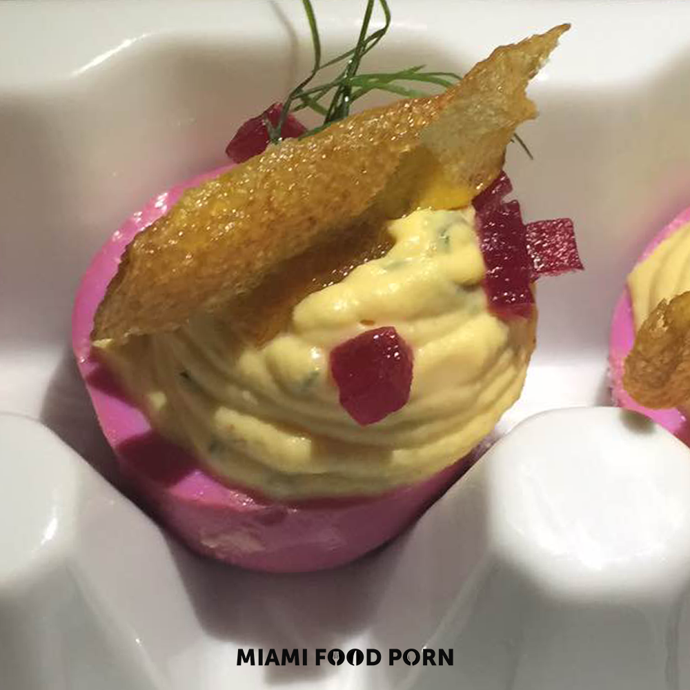 Drunken deviled eggs with pickled roots & sunchoke.