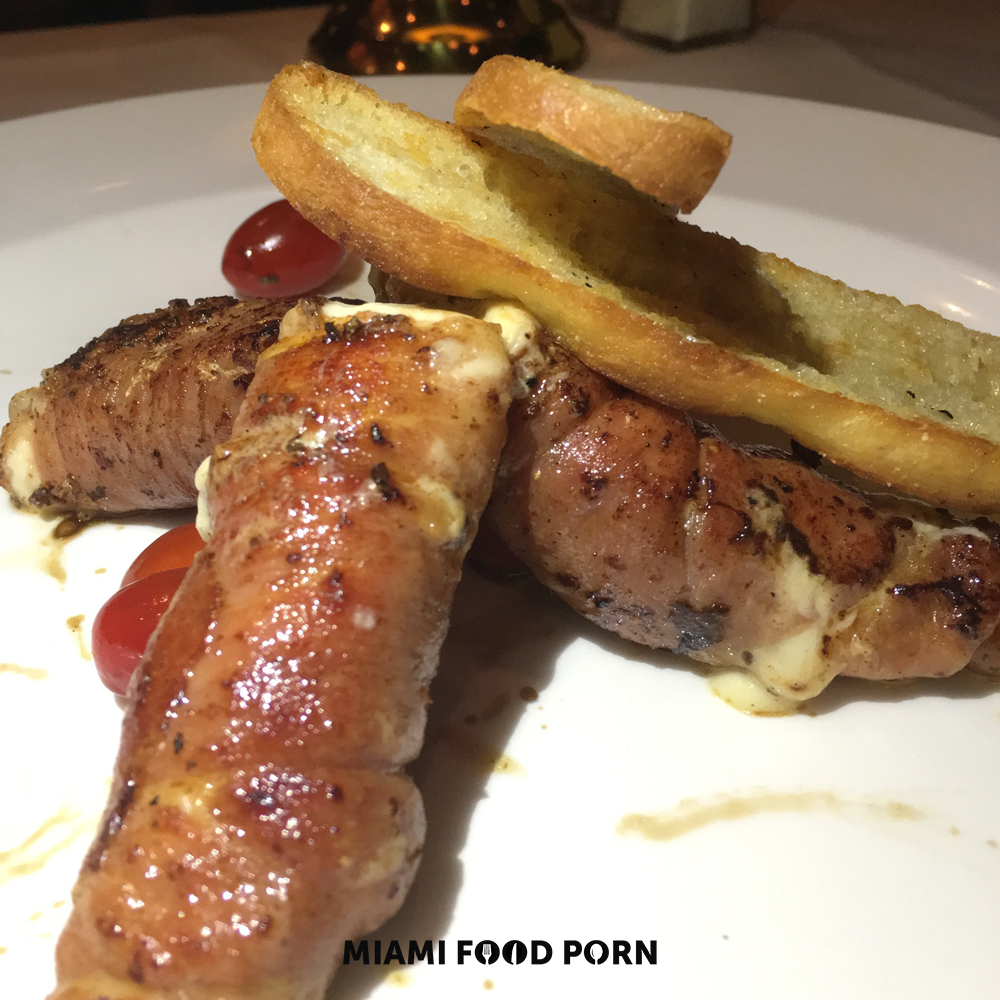Prosciutto wrapped mozzarella with vine ripe tomatoes