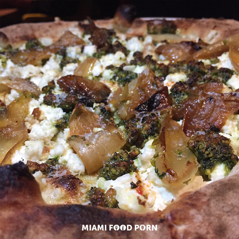 Pistachio Pesto Pizza with house made ricotta, charred onion and pecorino