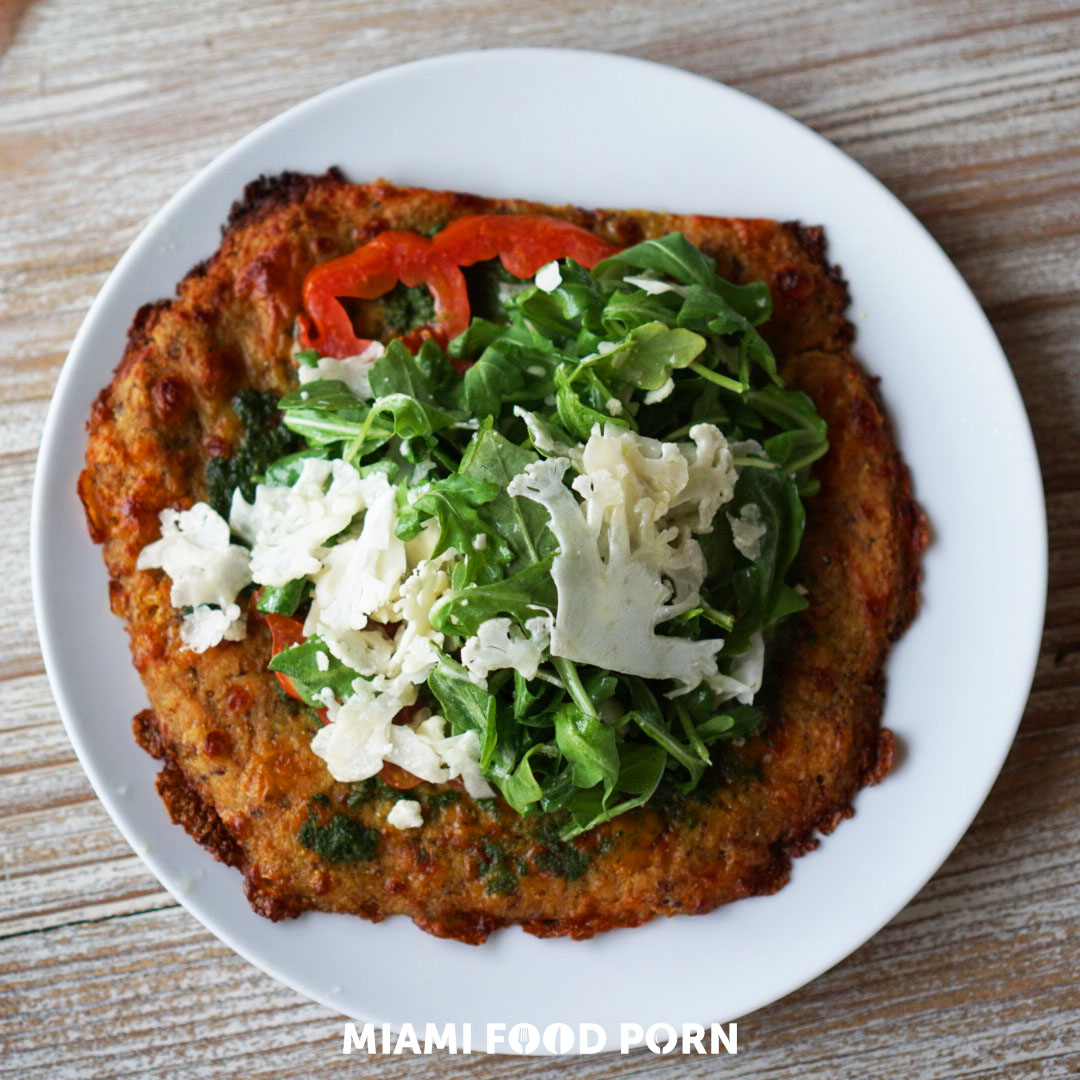 Cauliflower Crust Pizza: mozzarella, heirloom tomato, pesto, arugula, roasted cauliflower