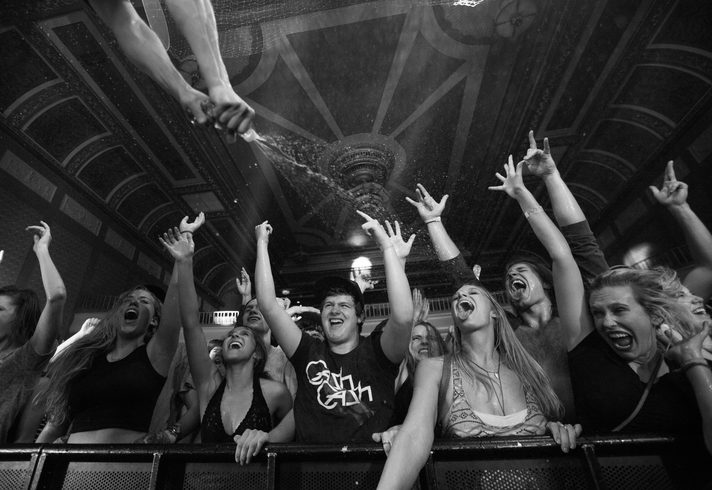  Chad Cisneros of Tritonal sprays water onto the crowd at the end of Cash Cash and Tritonal's back-to-back set at The Wilma in Missoula, Mont. on Oct. 21, 2015. 