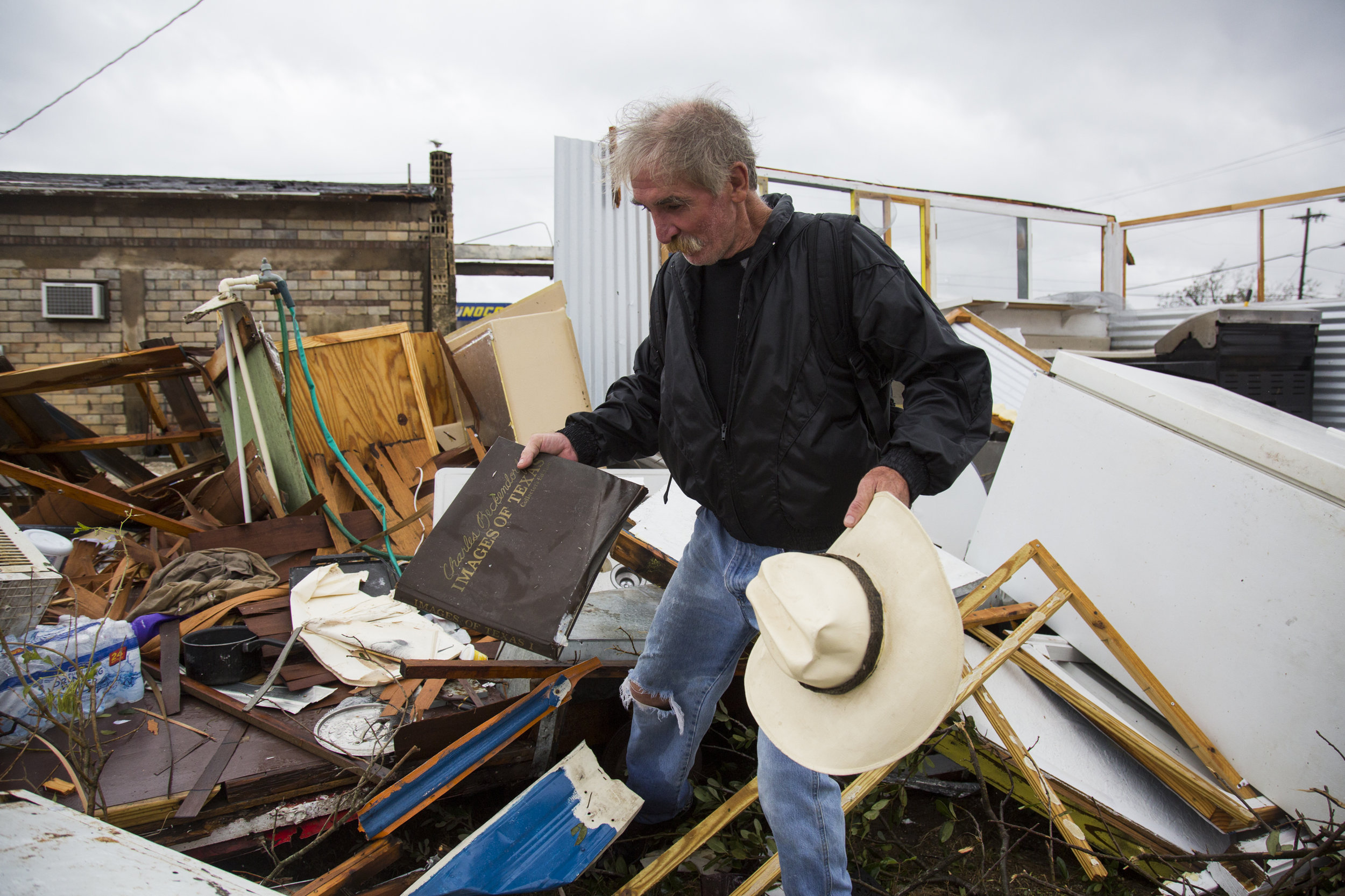 Harold Nubles, 54, searches through what is left of his barbecue truck in Refugio, Texas that was destroyed by Hurricane Harvey on Aug. 26, 2017.
