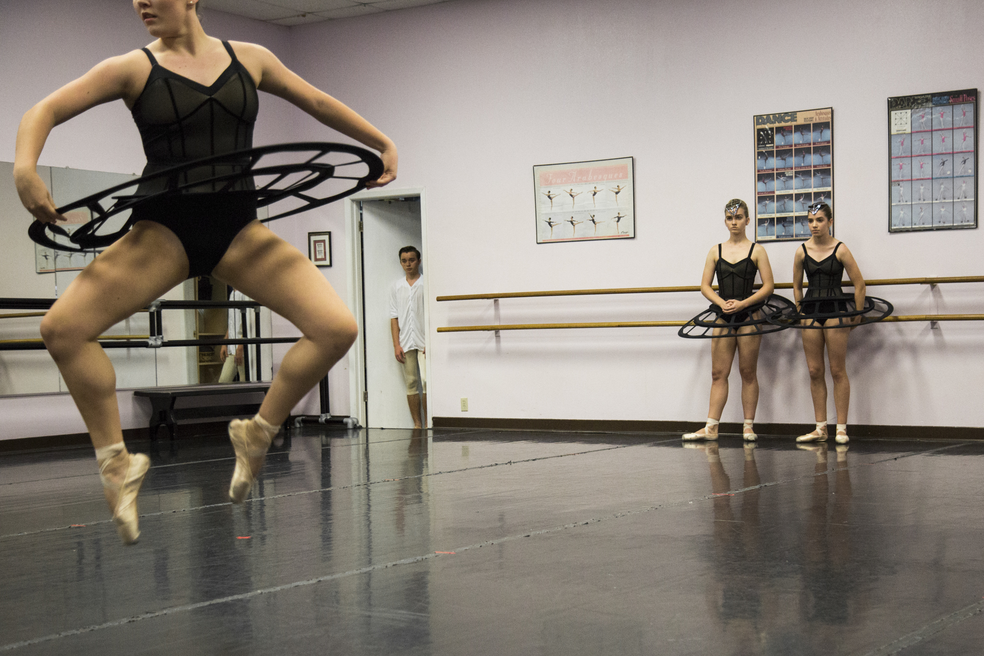 Kyle Haschke, 16, center, watches from a doorway as Victoria Ballet Theatre dancers rehearse their fall piece, "sub/merged" at the Busby Dancenter.