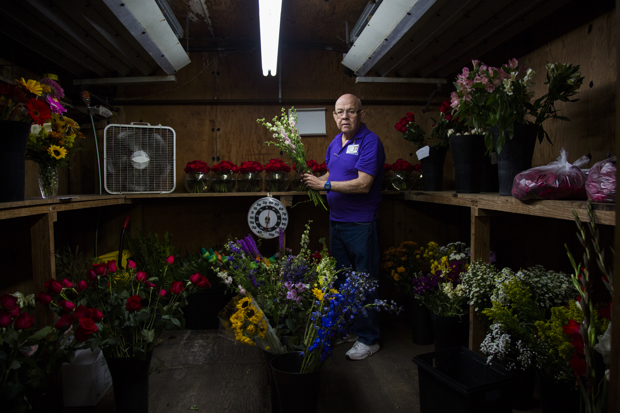  Felix Perez, 67, rearranges a handful of flowers in Devereux Gardens' flower cooler during one of his work days in Victoria, Texas on Nov. 9, 2017. Perez has always loved working in floral but after being laid off from his job in the floral departme