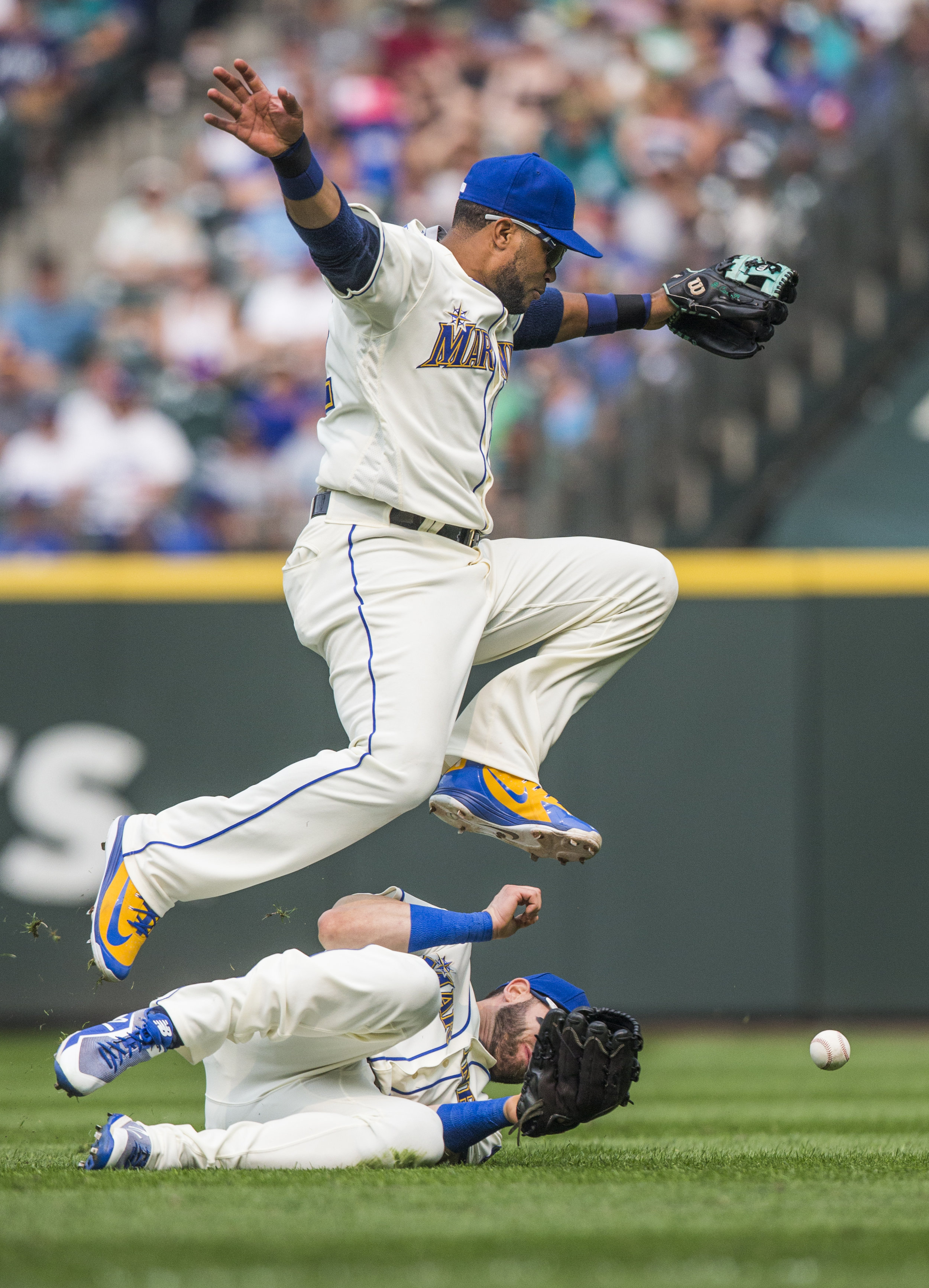  The Seattle Mariners' Robinson Cano jumps over teammate Mitch Haniger during the Sunday game against the Los Angeles Dodgers on Aug. 19, 2018 in Seattle, Washington. The Mariners lost to the Dodgers, 12-1. 